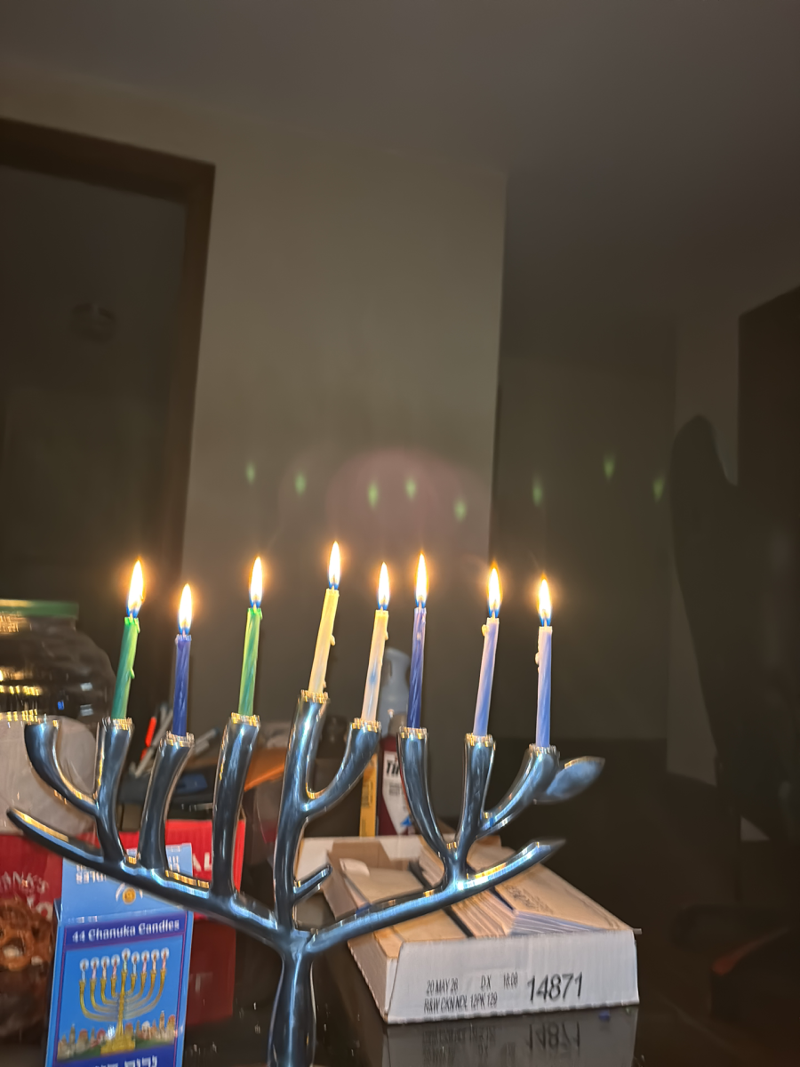 Chanukia shaped like the Tree of Life with eight lit candles